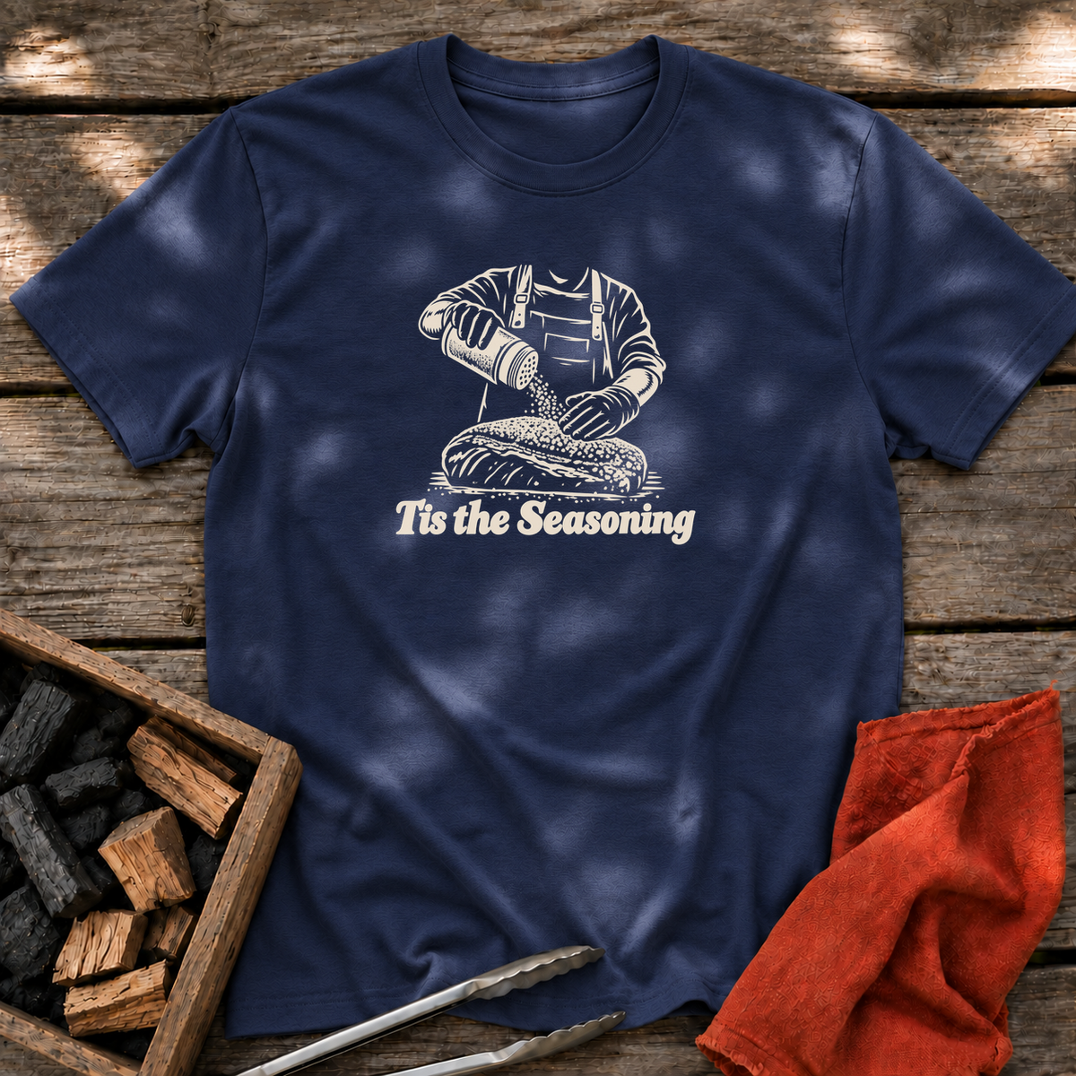 Navy T-shirt with the design “Tis the Seasoning” printed on the front.