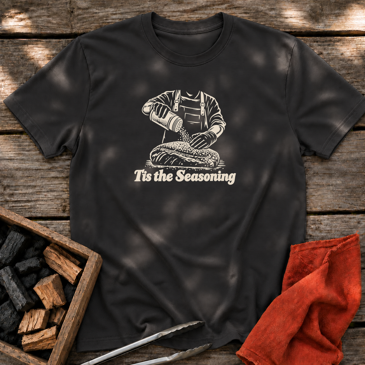 Black T-shirt with the design “Tis the Seasoning” printed on the front.