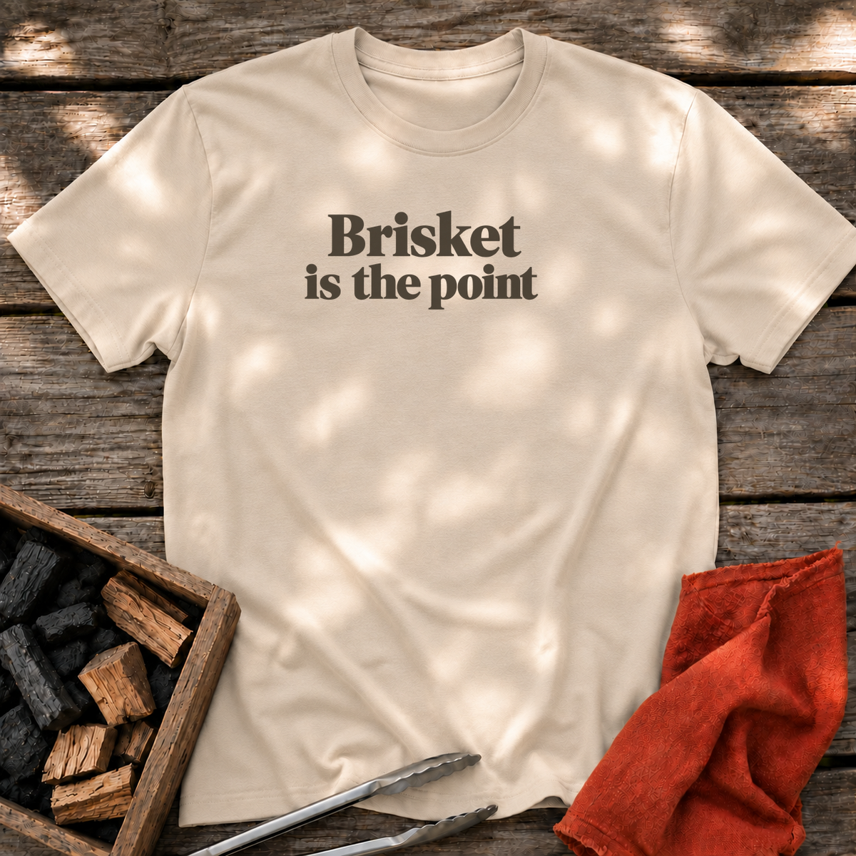 Sand T-shirt with the design “Brisket is the point.” printed on the front.