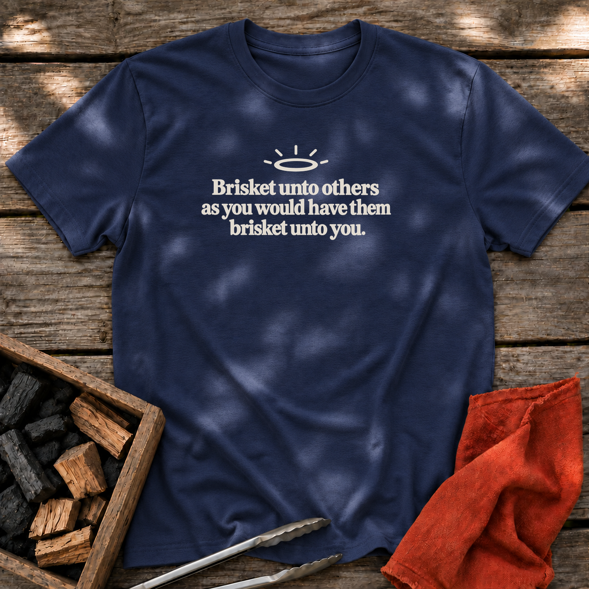 Navy T-shirt with the design “Brisket unto others as you would have them brisket unto you.” printed on the front.