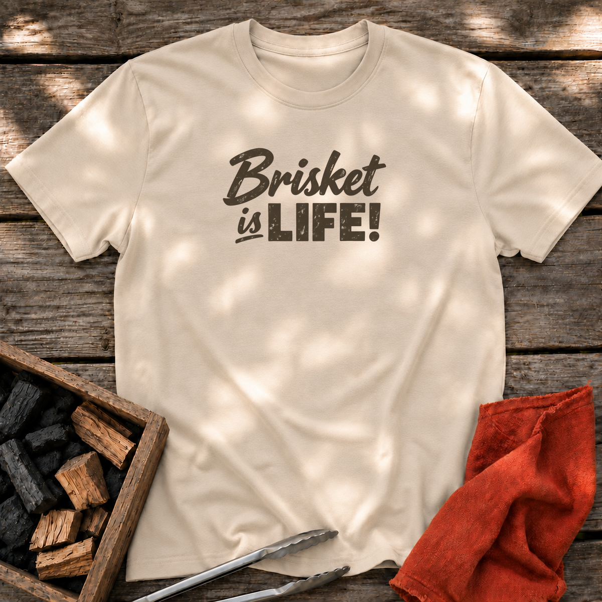 Sand T-shirt with the design “Brisket is LIFE!” printed on the front.