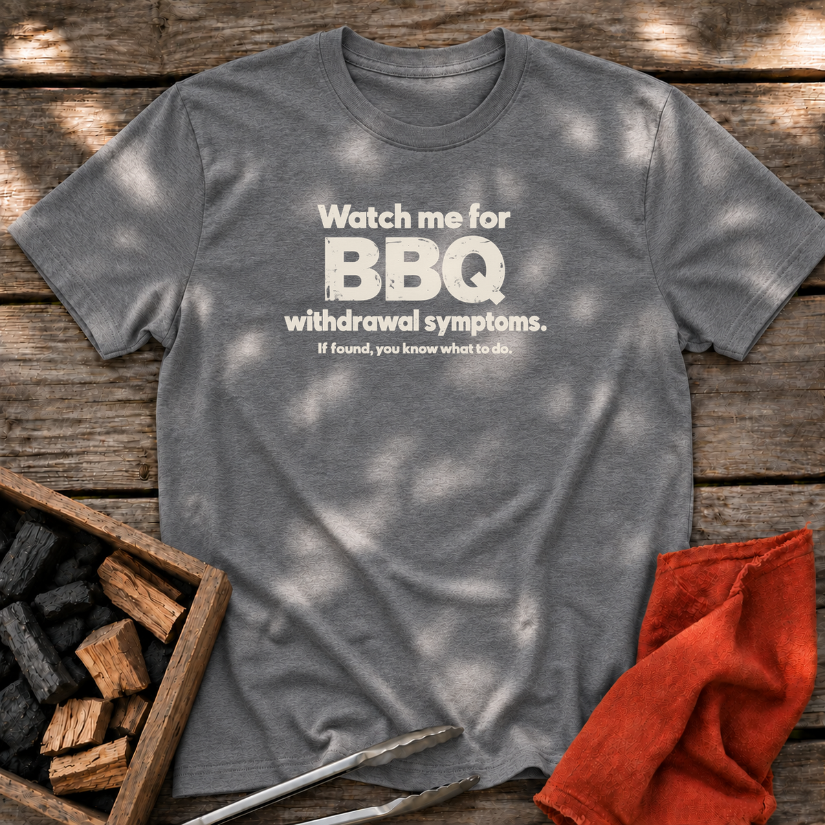 Graphite Heather T-shirt with the design “Watch me for BBQ withdrawal symptoms. If found, you know what to do.” printed on the front.