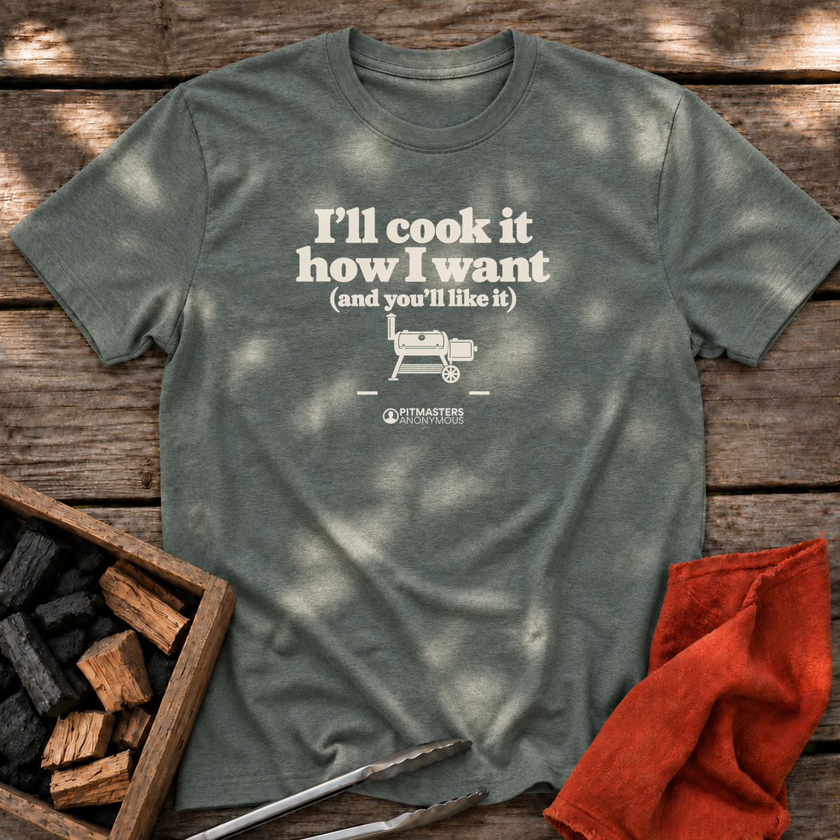 Heather Military Green T-shirt with the design “I'll cook it how I want (and you'll like it)” printed on the front.