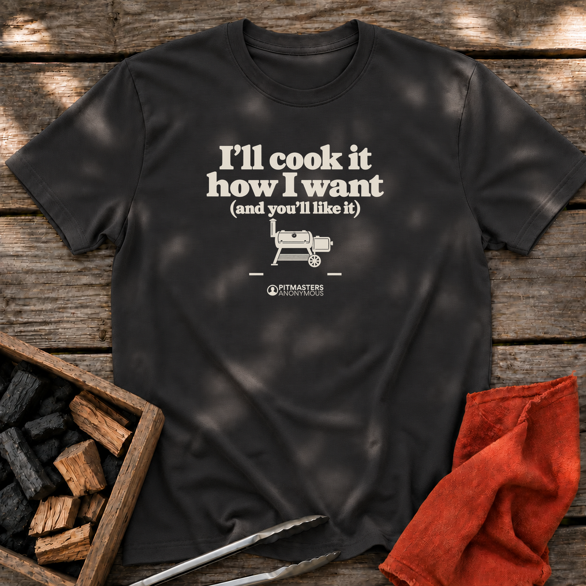Black T-shirt with the design “I'll cook it how I want (and you'll like it)” printed on the front.