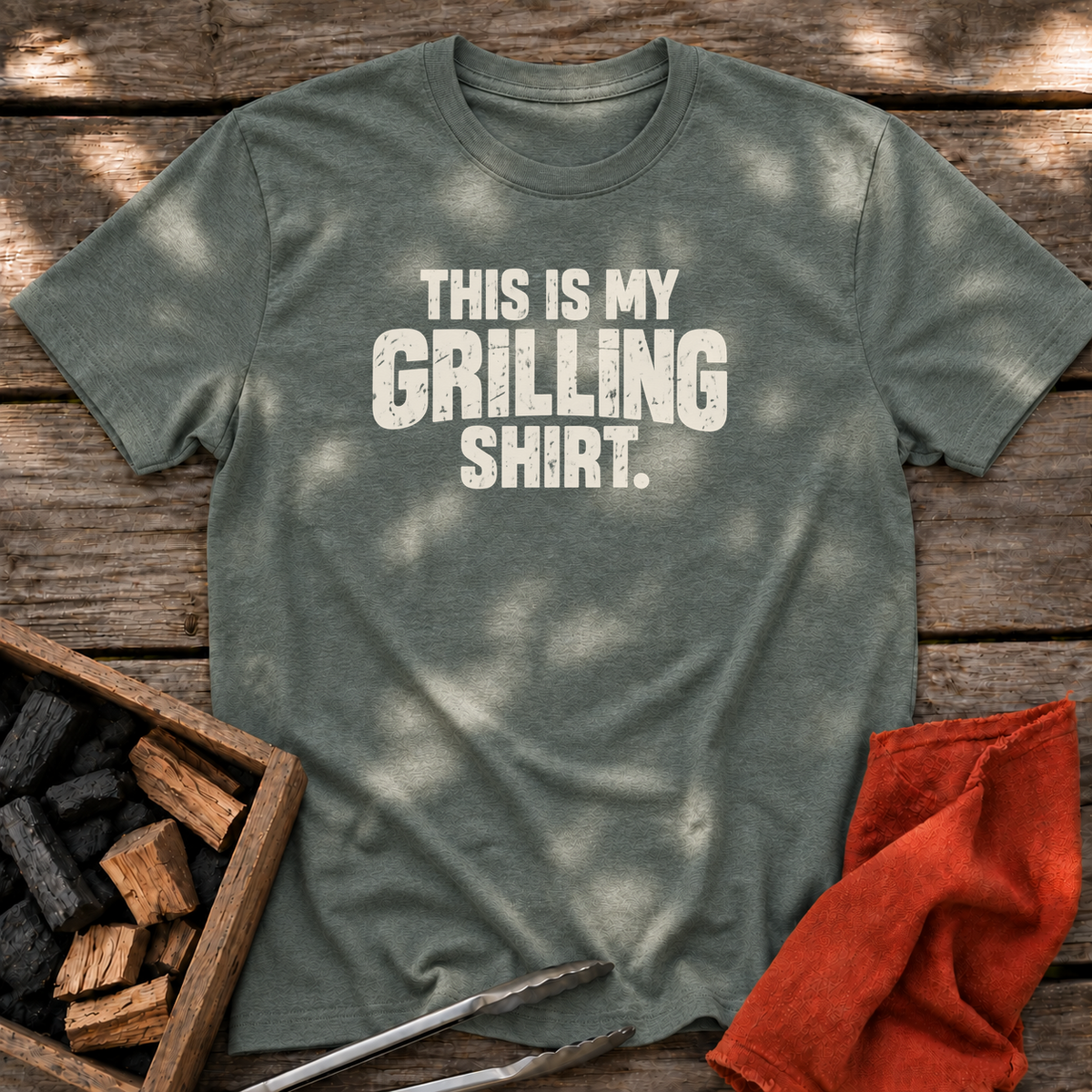 Heather Military Green T-shirt with the design “This is My Grilling Shirt.” printed on the front.