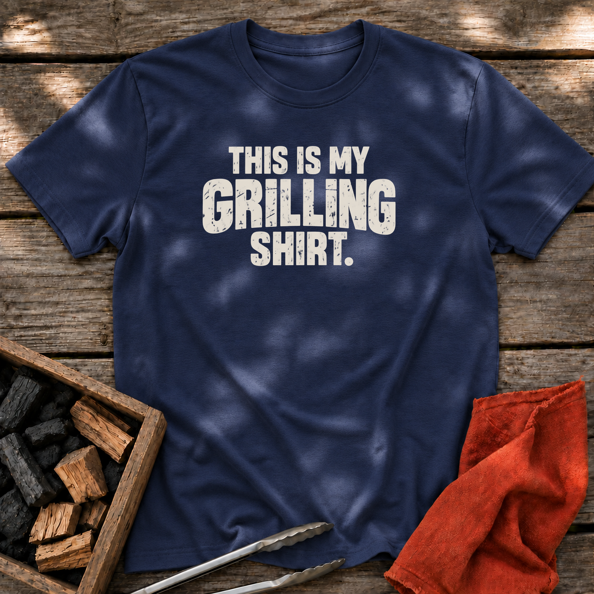 Navy T-shirt with the design “This is My Grilling Shirt.” printed on the front.