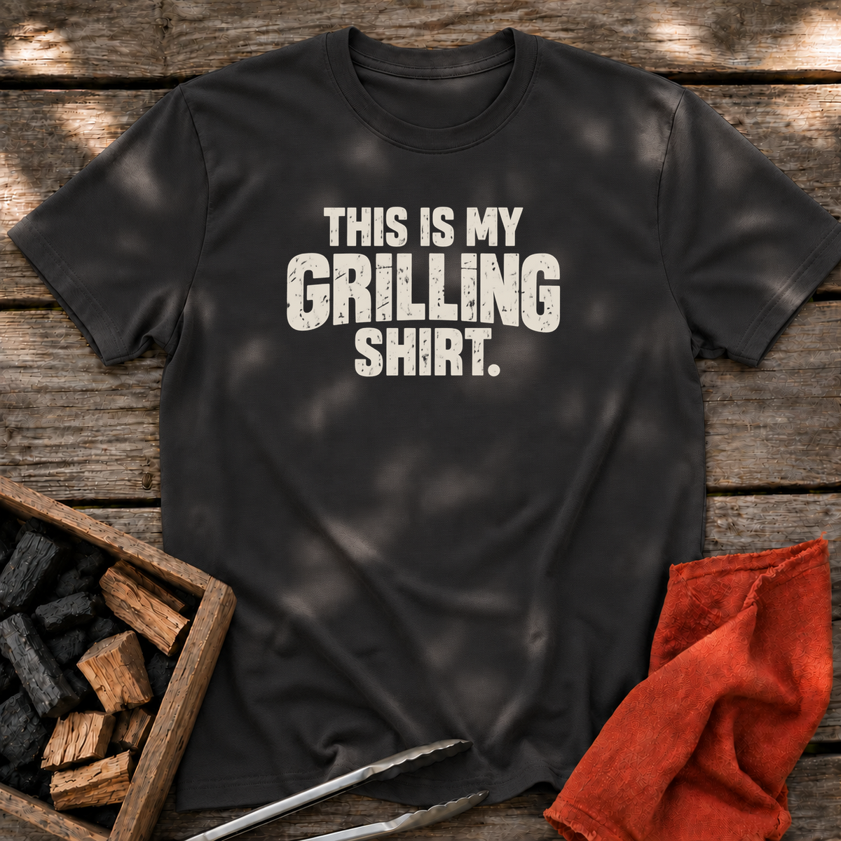 Black T-shirt with the design “This is My Grilling Shirt.” printed on the front.