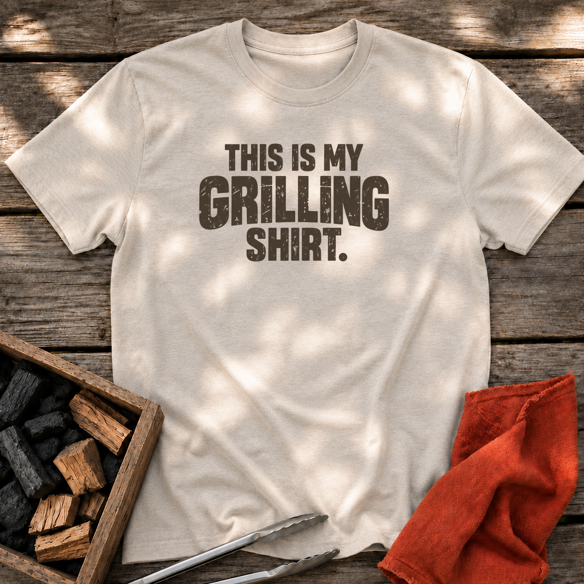 Natural T-shirt with the design “This is My Grilling Shirt.” printed on the front.