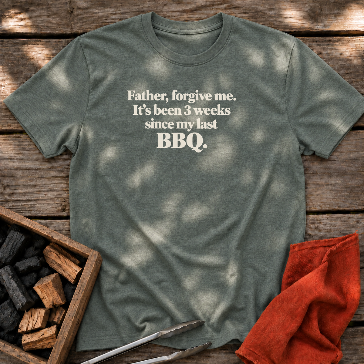 Heather Military Green T-shirt with the design “Father, forgive me. It's been 3 weeks since my last BBQ” printed on the front.