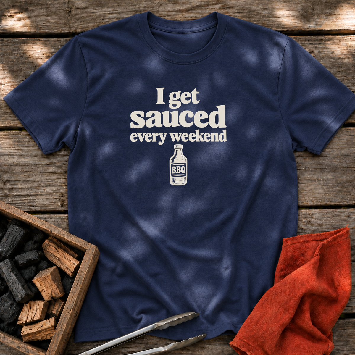 Navy T-shirt with the design “I get sauced every weekend” printed on the front.