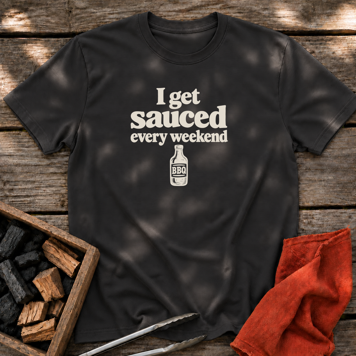Black T-shirt with the design “I get sauced every weekend” printed on the front.
