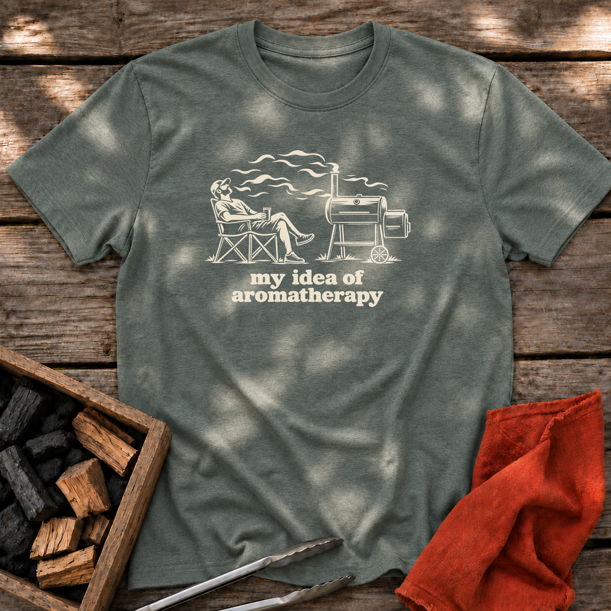 Heather Military Green T-shirt with the design “my idea of aromatherapy” printed on the front.