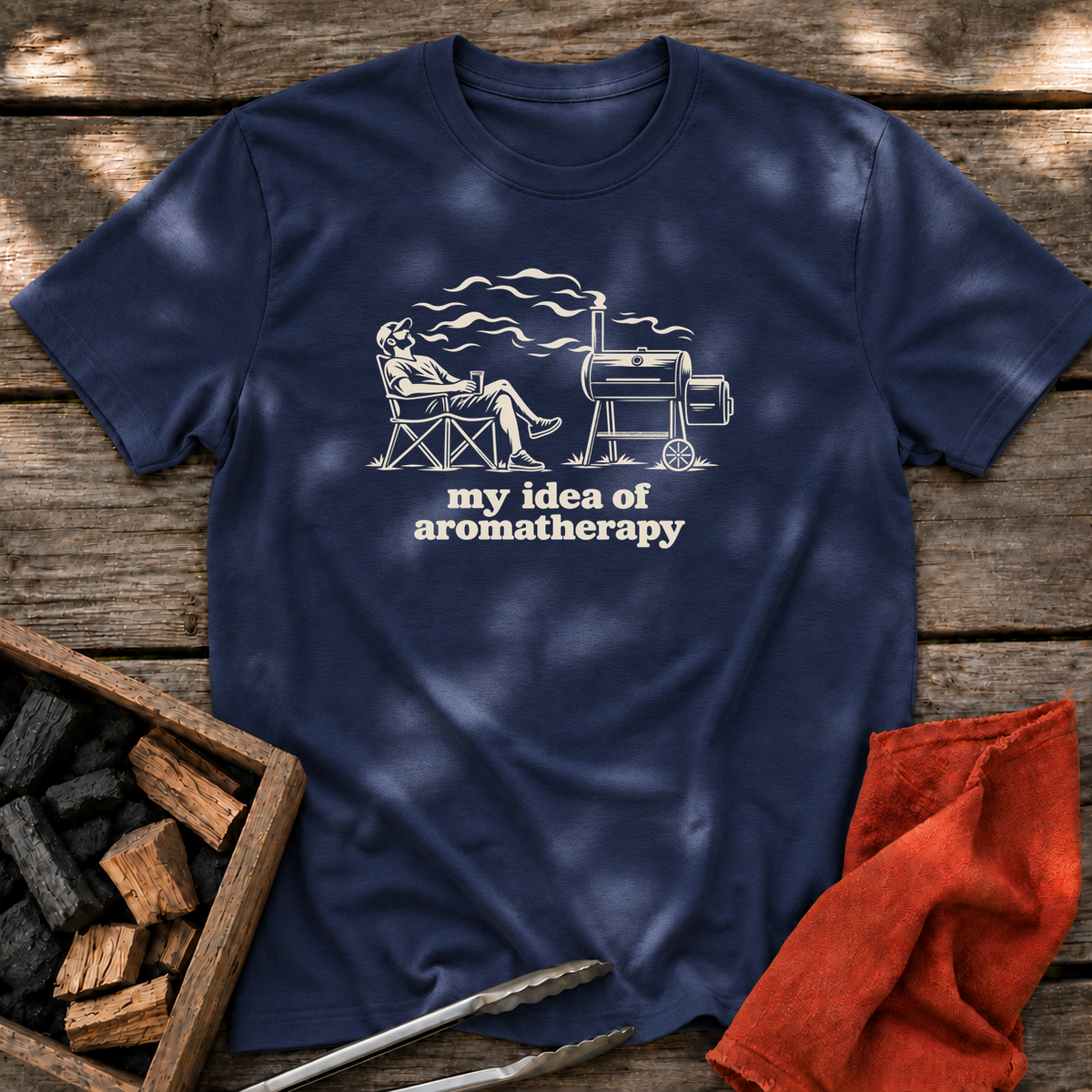 Navy T-shirt with the design “my idea of aromatherapy” printed on the front.