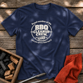 Navy T-shirt with the design “Proud member of the BBQ Cleanup Crew. (Are you gonna finish that?)” printed on the front.