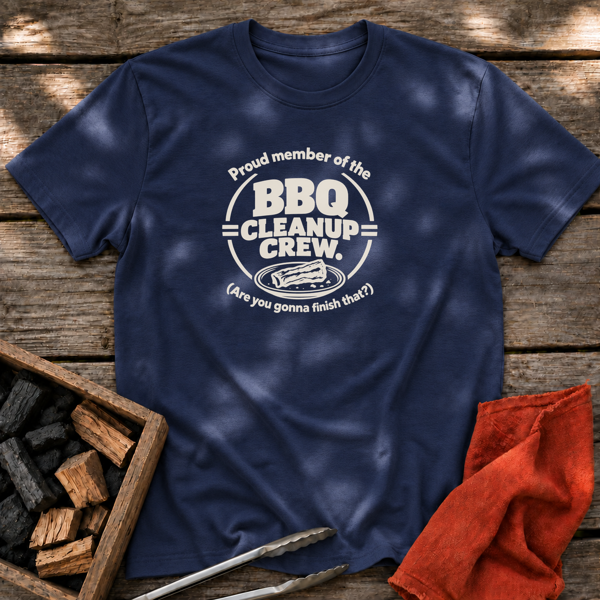 Navy T-shirt with the design “Proud member of the BBQ Cleanup Crew. (Are you gonna finish that?)” printed on the front.