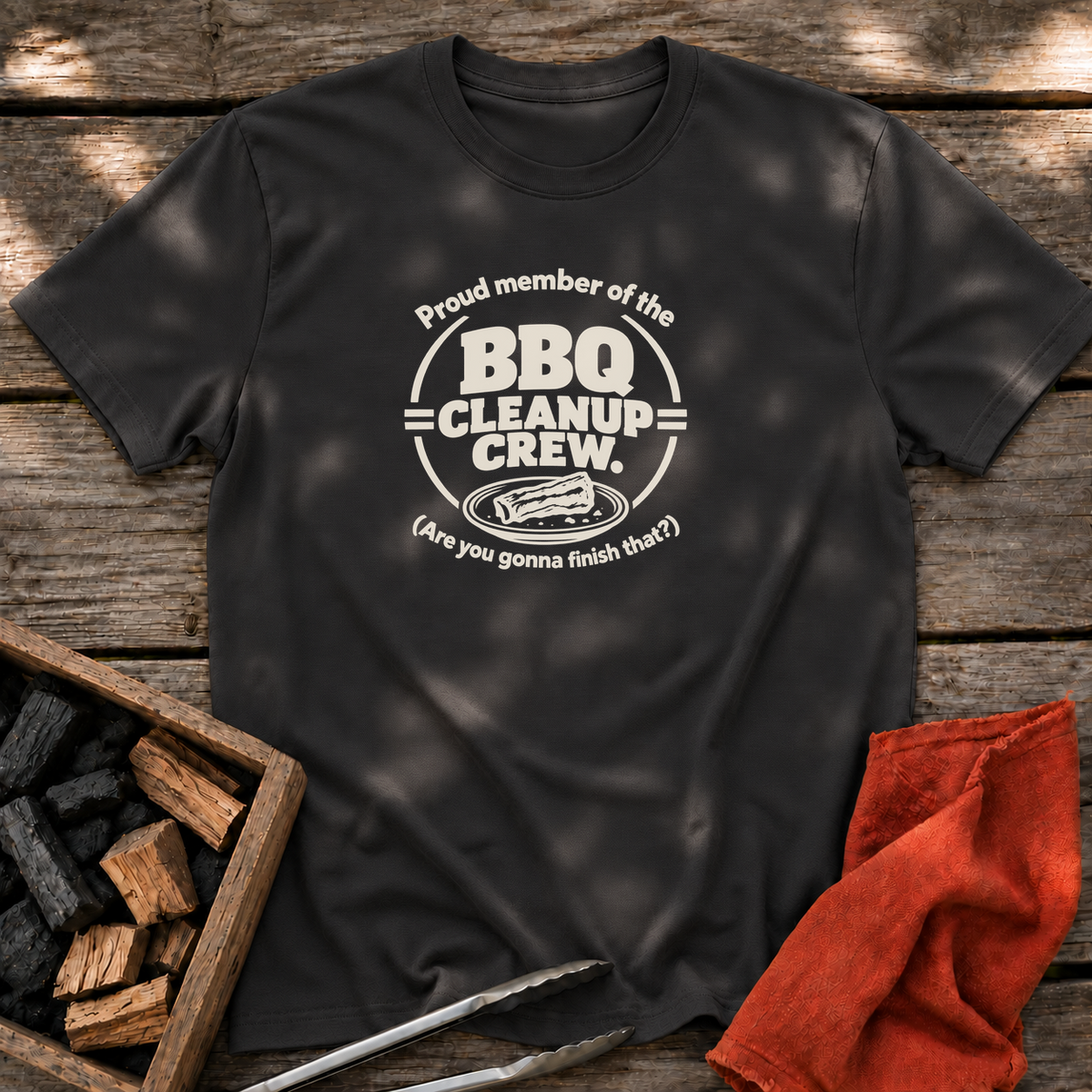 Black T-shirt with the design “Proud member of the BBQ Cleanup Crew. (Are you gonna finish that?)” printed on the front.