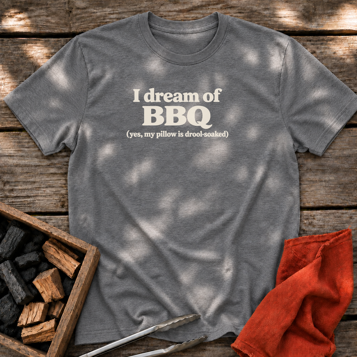 Graphite Heather T-shirt with the design “I dream of BBQ (yes, my pillow is drool-soaked)” printed on the front.