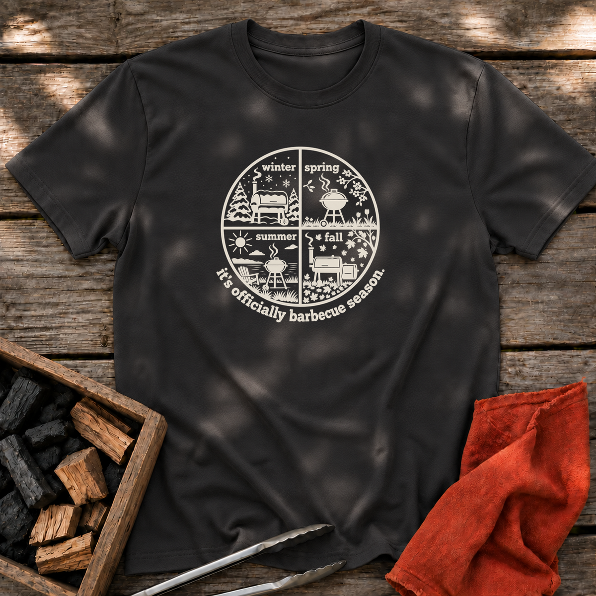 Black T-shirt with the design “it's officially barbecue season” printed on the front.