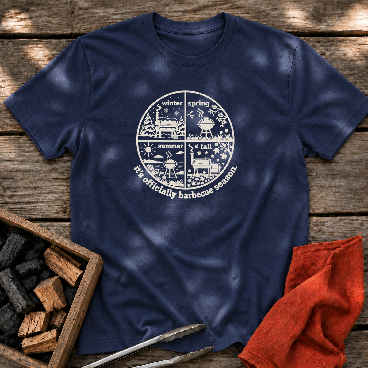 Navy T-shirt with the design “it's officially barbecue season” printed on the front.