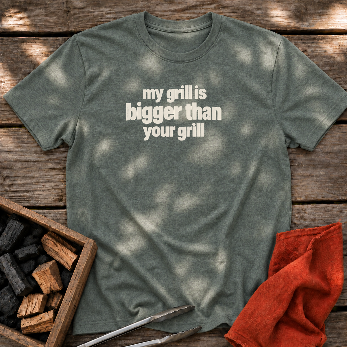 Heather Military Green T-shirt with the design “my grill is bigger than your grill” printed on the front.