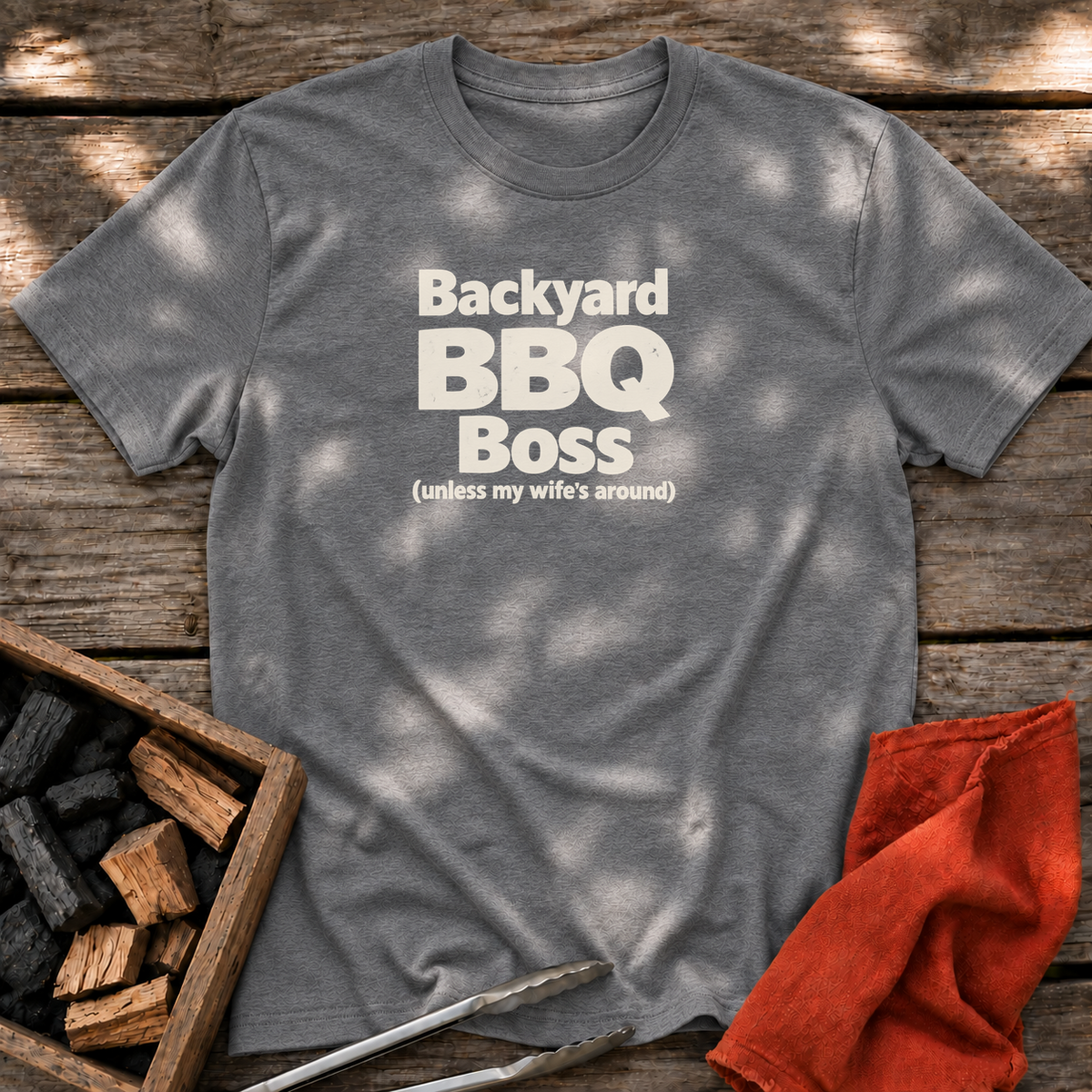 Graphite Heather T-shirt with the design “Backyard BBQ Boss (unless my wife's around)” printed on the front.