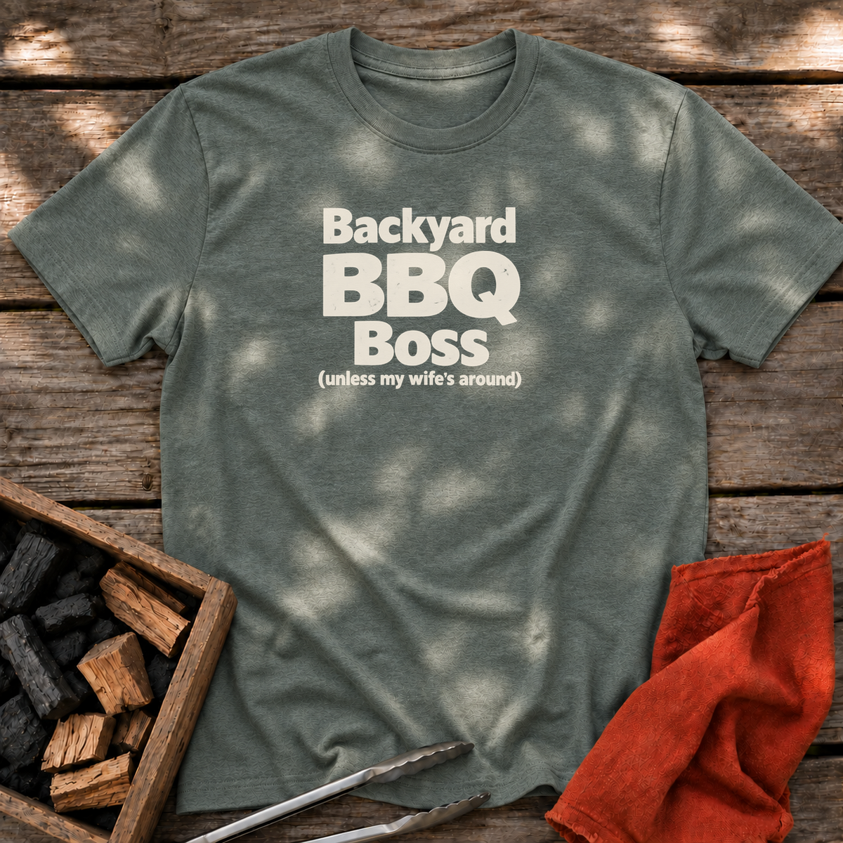 Heather Military Green T-shirt with the design “Backyard BBQ Boss (unless my wife's around)” printed on the front.