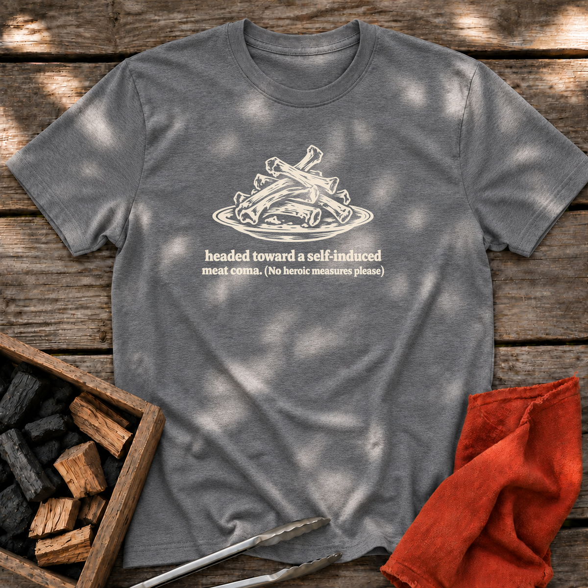 Graphite Heather T-shirt with the design “headed toward a self-induced meat coma. (No heroic measures please)” printed on the front.
