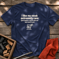 Navy T-shirt with the design “i like my steak extremely rare (just spank a cow on the ass and send it out)” printed on the front.