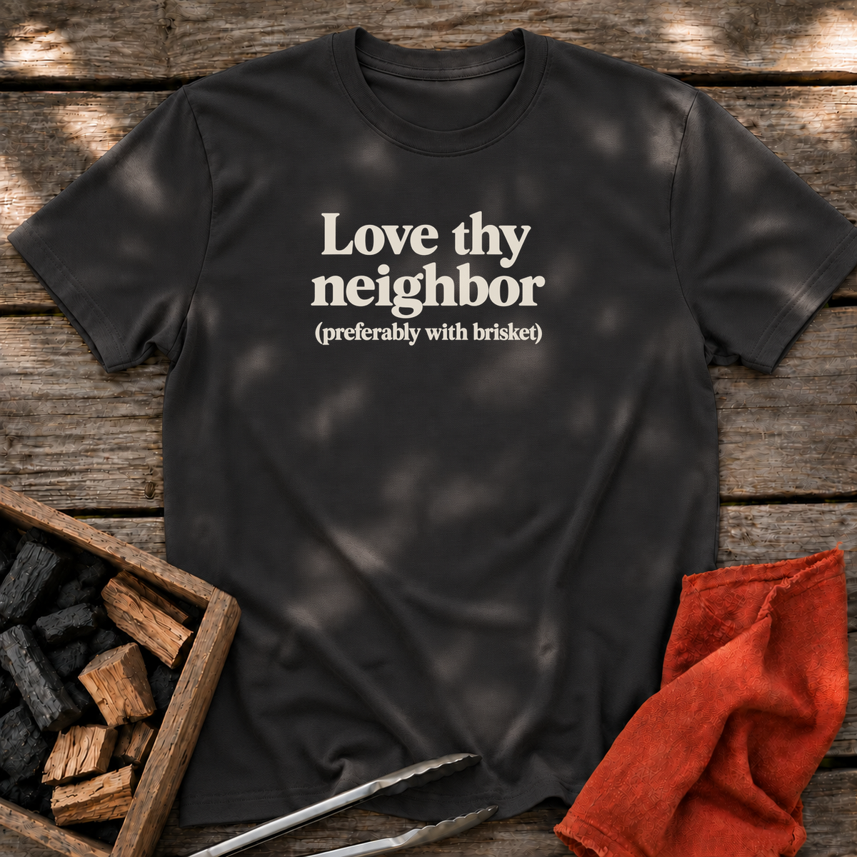 Black T-shirt with the design “Love thy neighbor (preferably with brisket)” printed on the front.