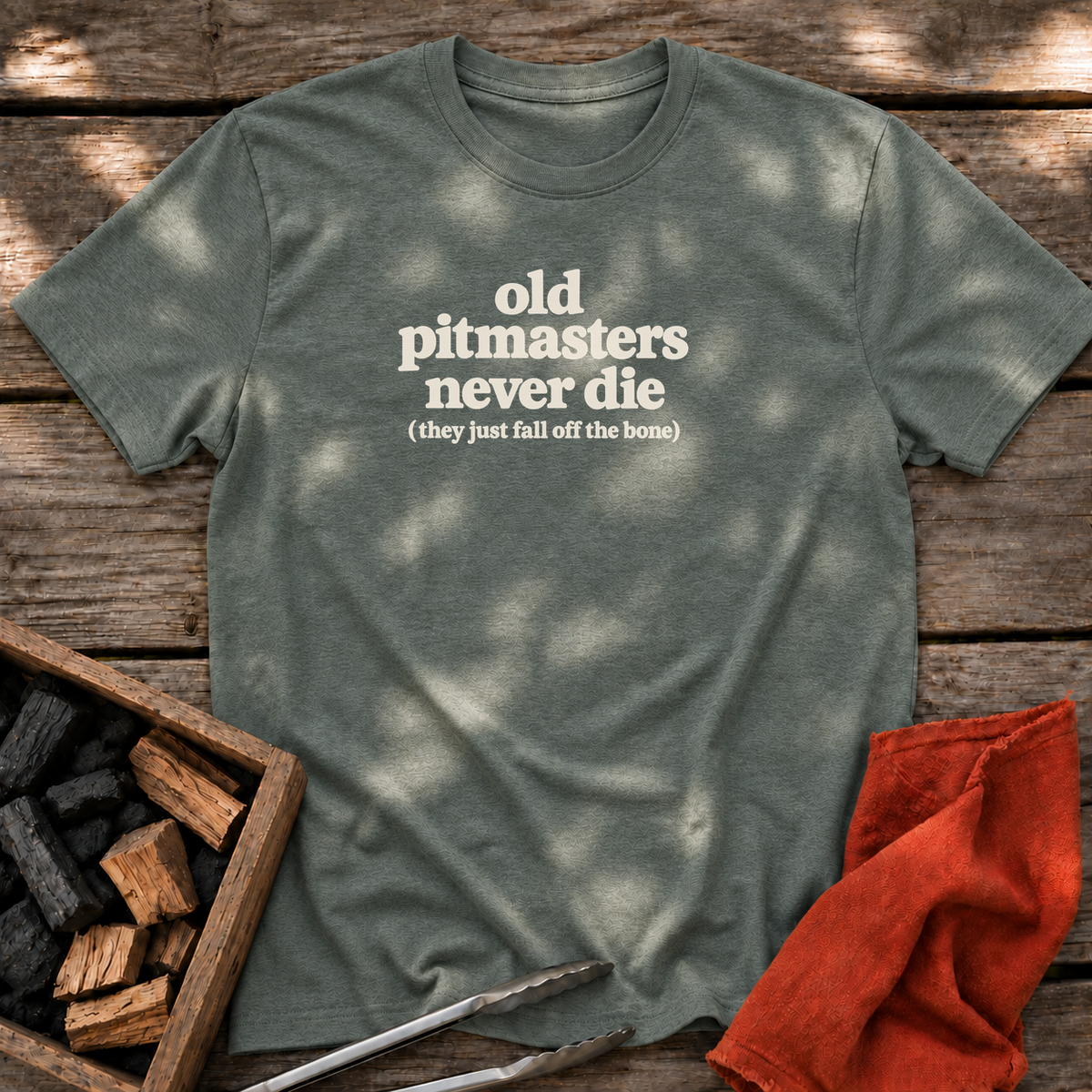 Heather Military Green T-shirt with the design “old pitmasters never die (they just fall off the bone)” printed on the front.