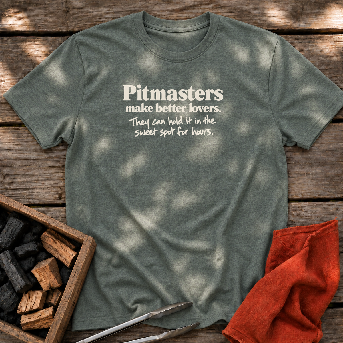 Heather Military Green T-shirt with the design “Pitmasters make better lovers. They can hold it in the sweet spot for hours.” printed on the front.