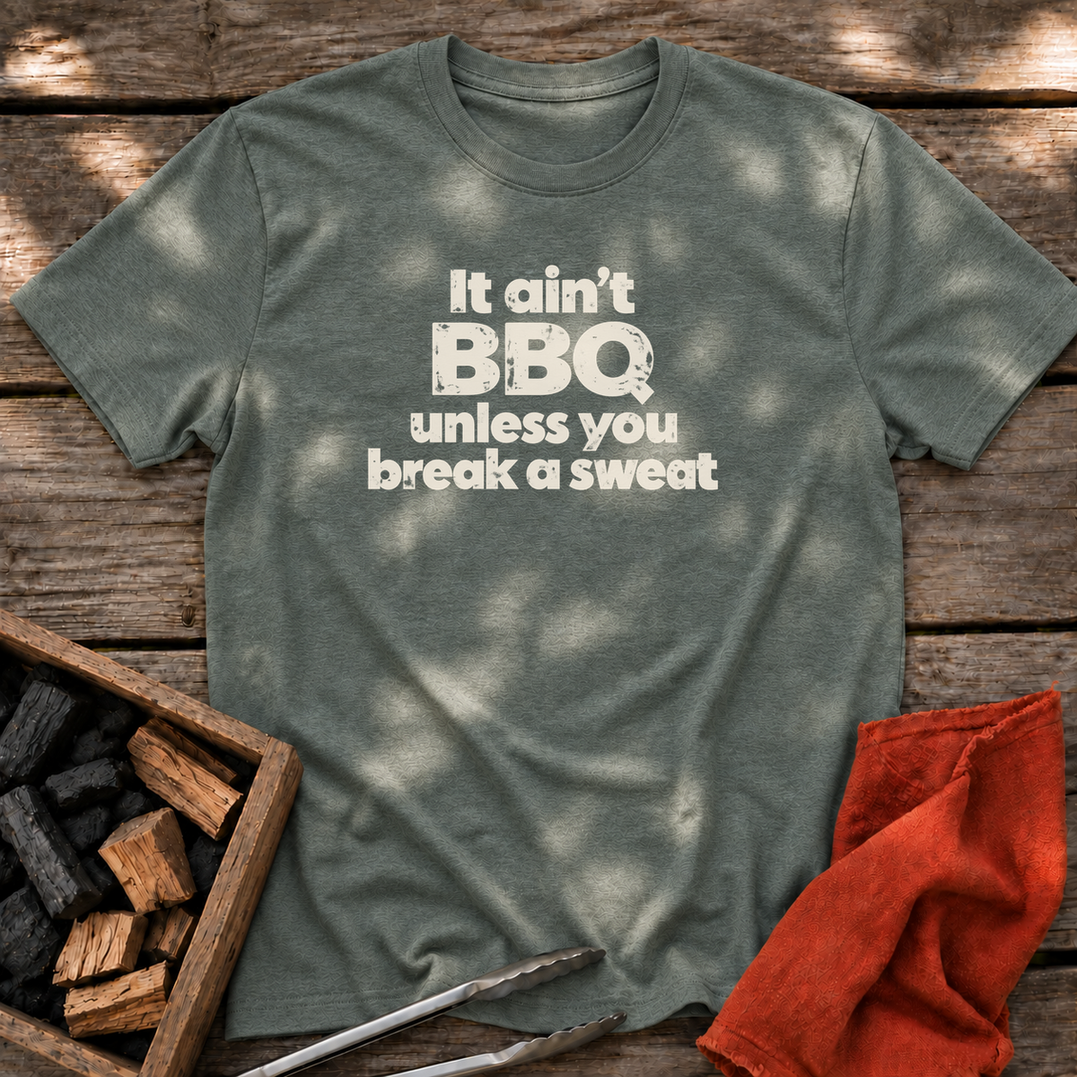 Heather Military Green T-shirt with the design “It ain't BBQ unless you break a sweat” printed on the front.