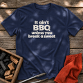 Navy T-shirt with the design “It ain't BBQ unless you break a sweat” printed on the front.