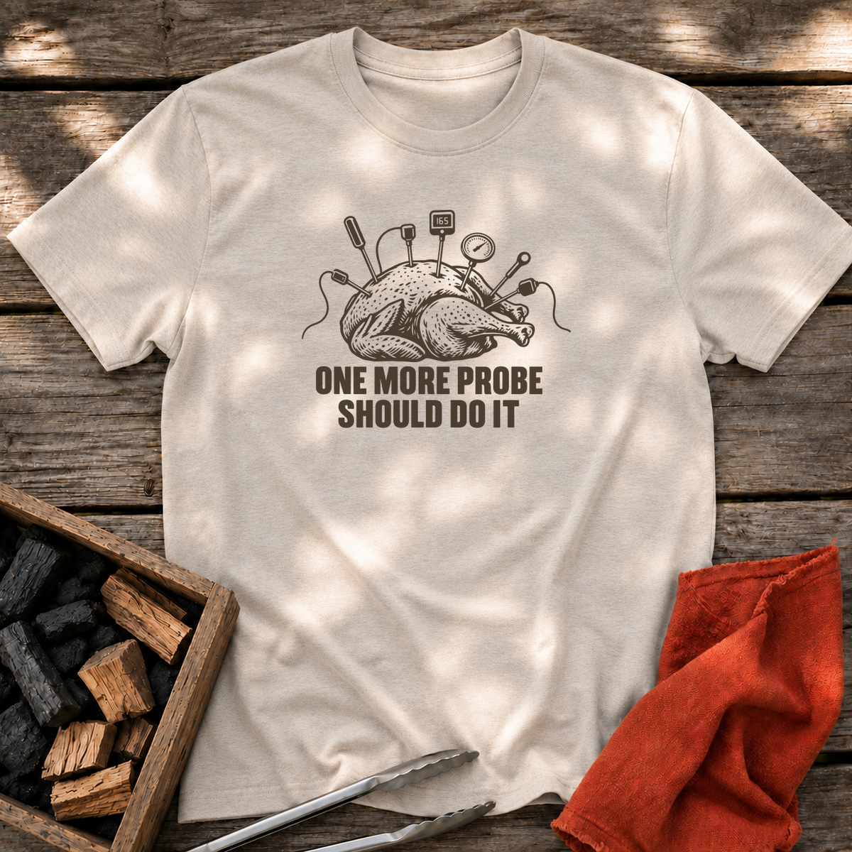 Natural T-shirt with the design “ONE MORE PROBE SHOULD DO IT” printed on the front.