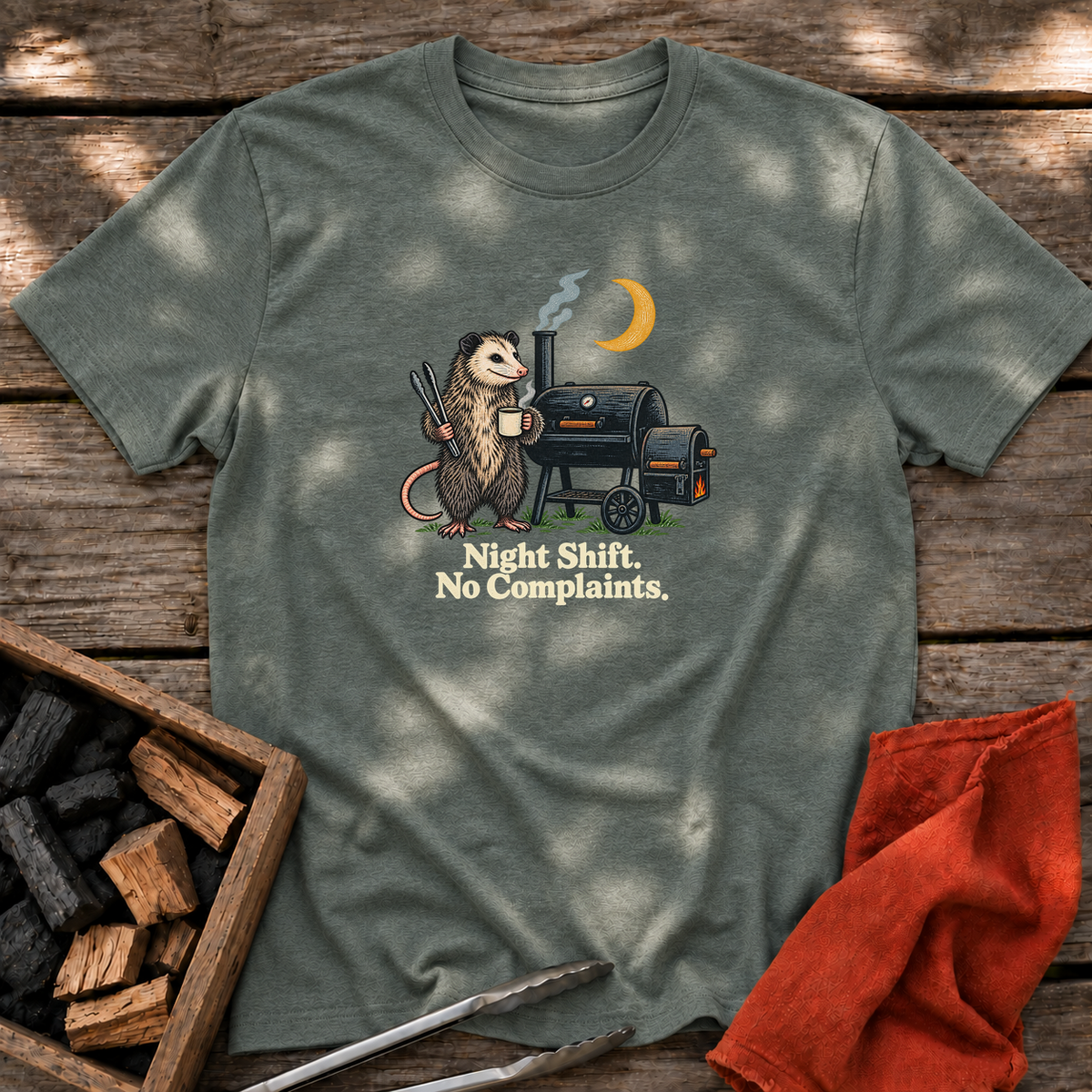Heather Military Green T-shirt with the design “Night Shift. No Complaints.” printed on the front.