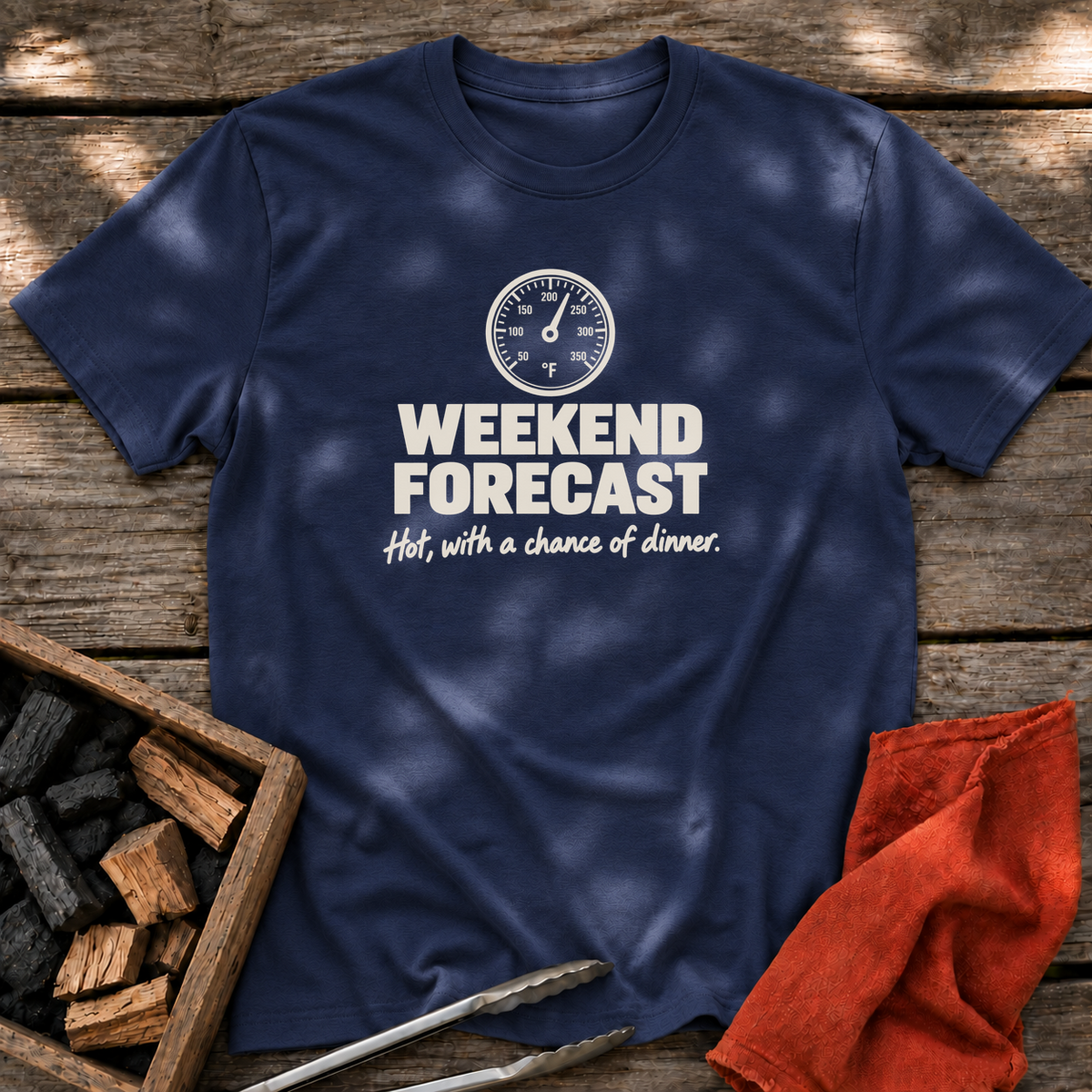 Navy T-shirt with the design “Weekend forecast: Hot, with a chance of dinner.” printed on the front.
