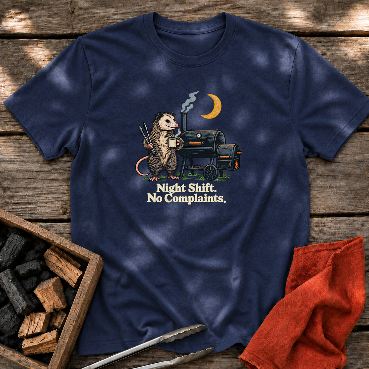 Navy T-shirt with the design “Night Shift. No Complaints.” printed on the front.
