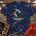 Navy T-shirt with the design “I've Been Monitoring This Closely.” printed on the front.