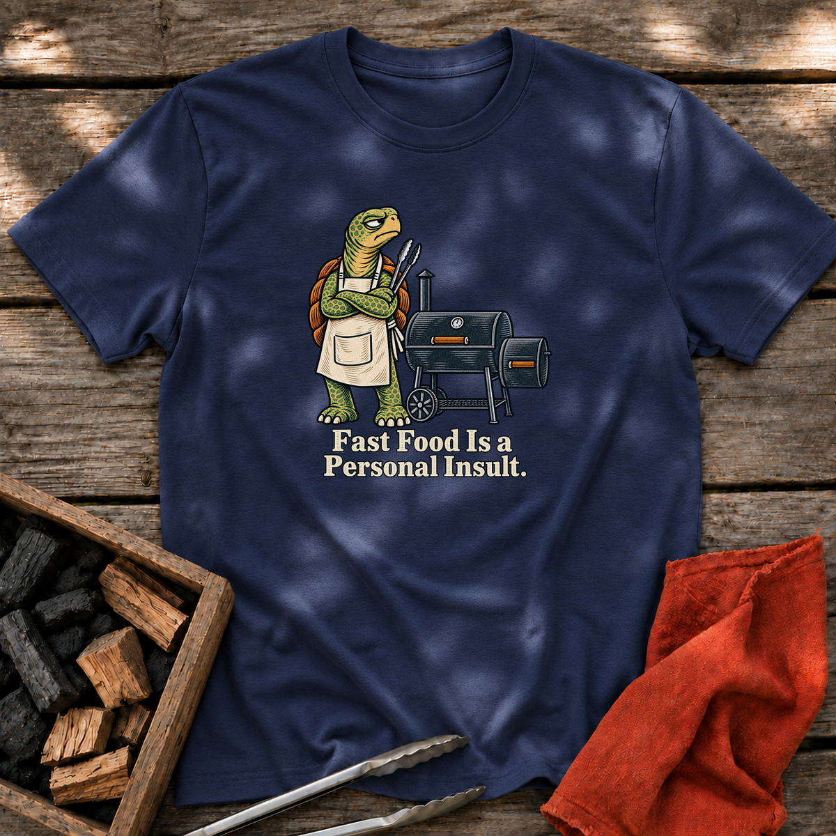 Navy T-shirt with the design “Fast Food Is a Personal Insult.” printed on the front.