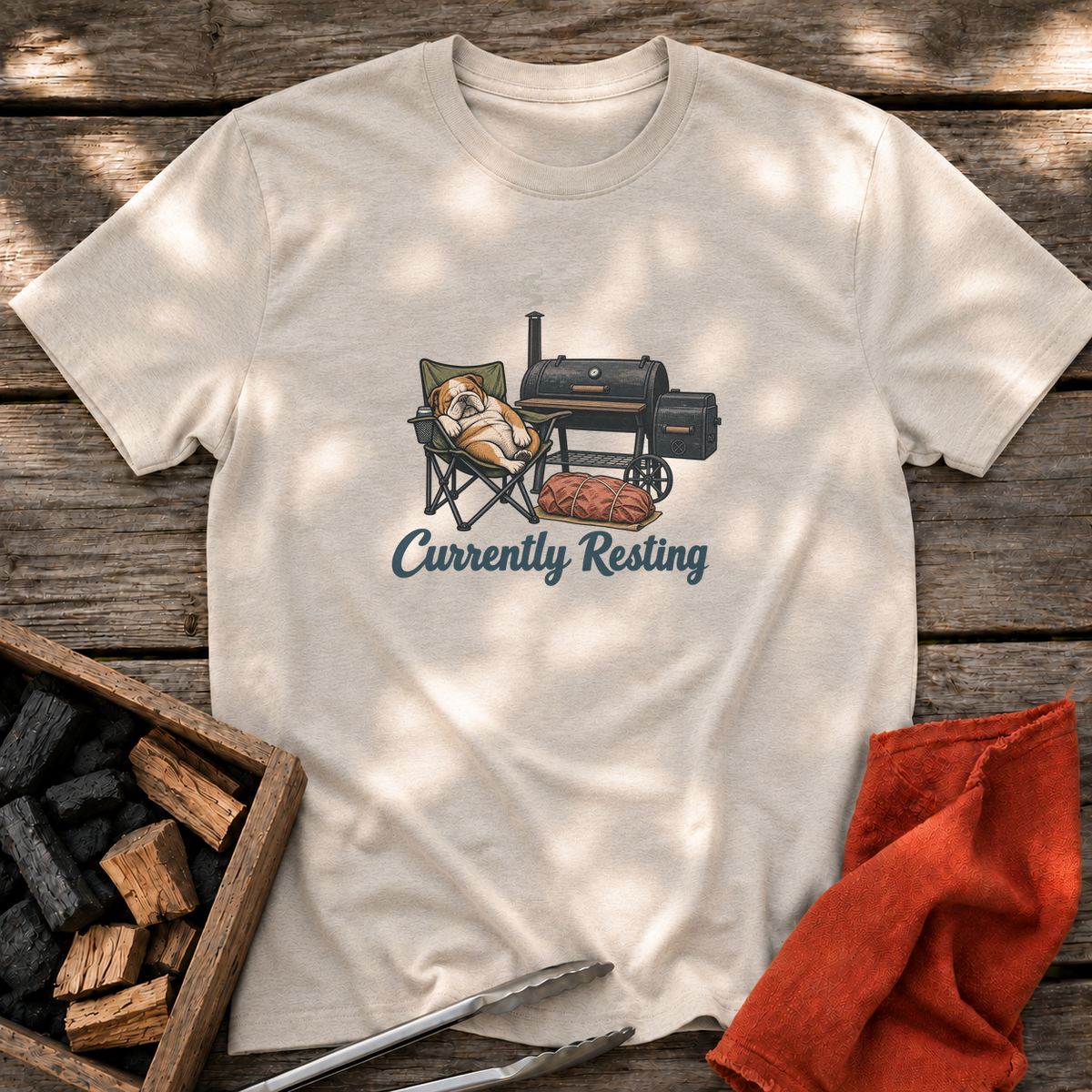 Natural T-shirt with the design “Currently Resting” printed on the front.