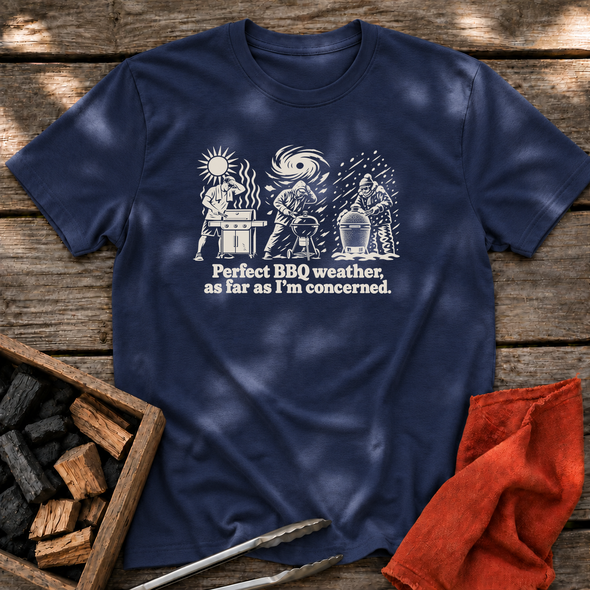 Navy T-shirt with the design “Perfect BBQ weather, as far as I'm concerned.” printed on the front.