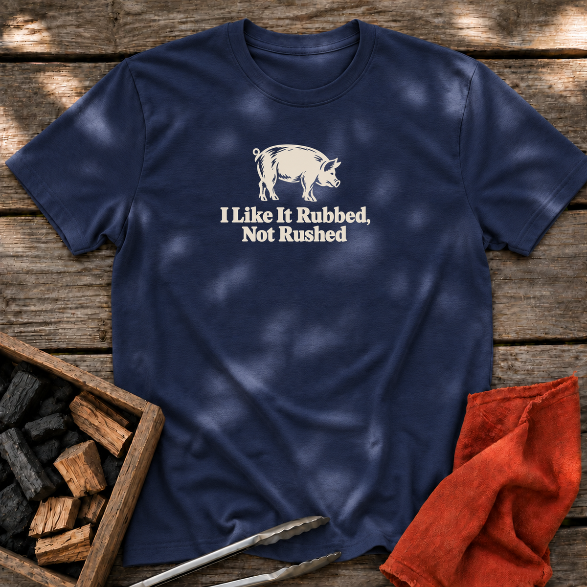 Navy T-shirt with the design “I Like It Rubbed, Not Rushed” printed on the front.