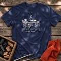 Navy T-shirt with the design “This was never going to be quick.” printed on the front.