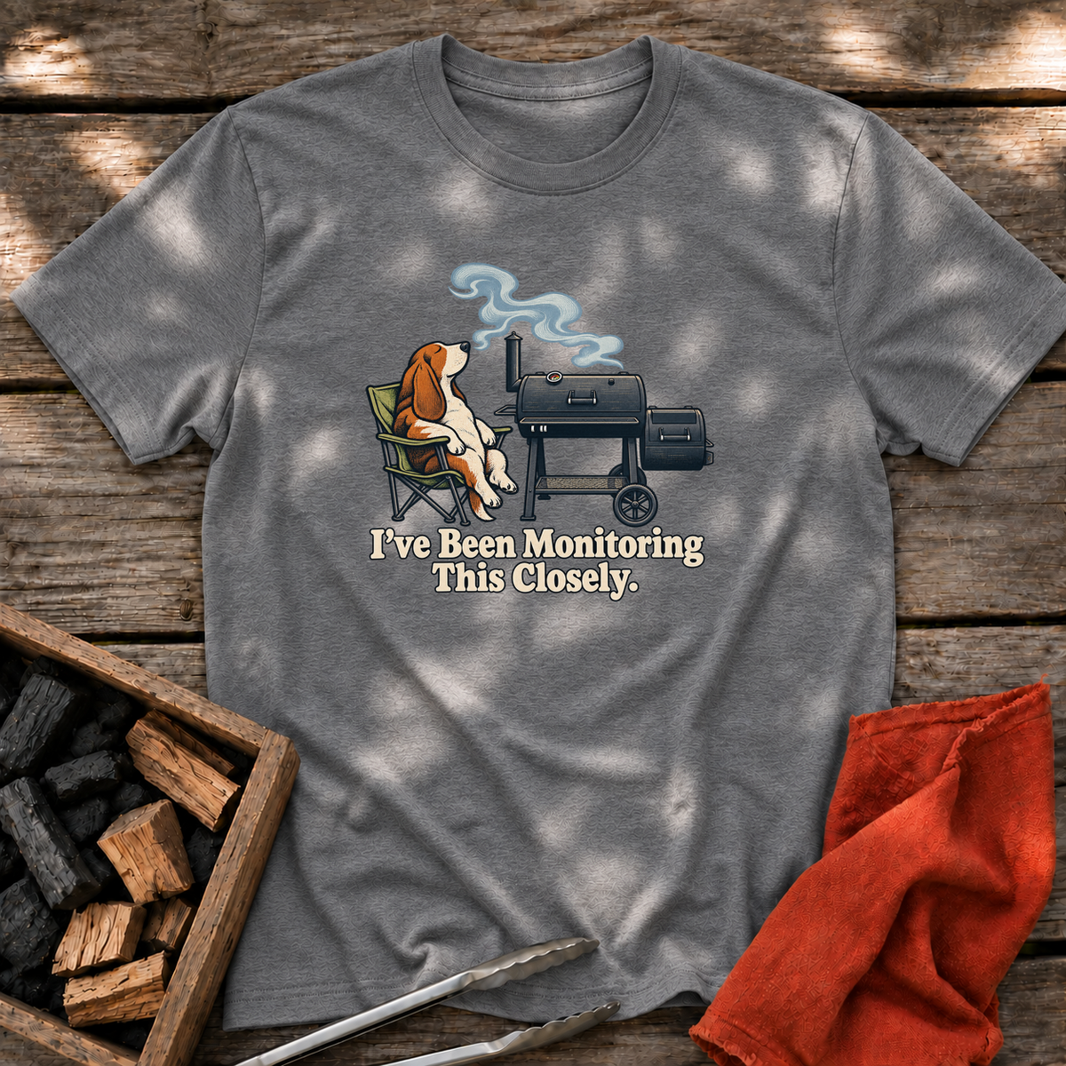Graphite Heather T-shirt with the design “I've Been Monitoring This Closely.” printed on the front.