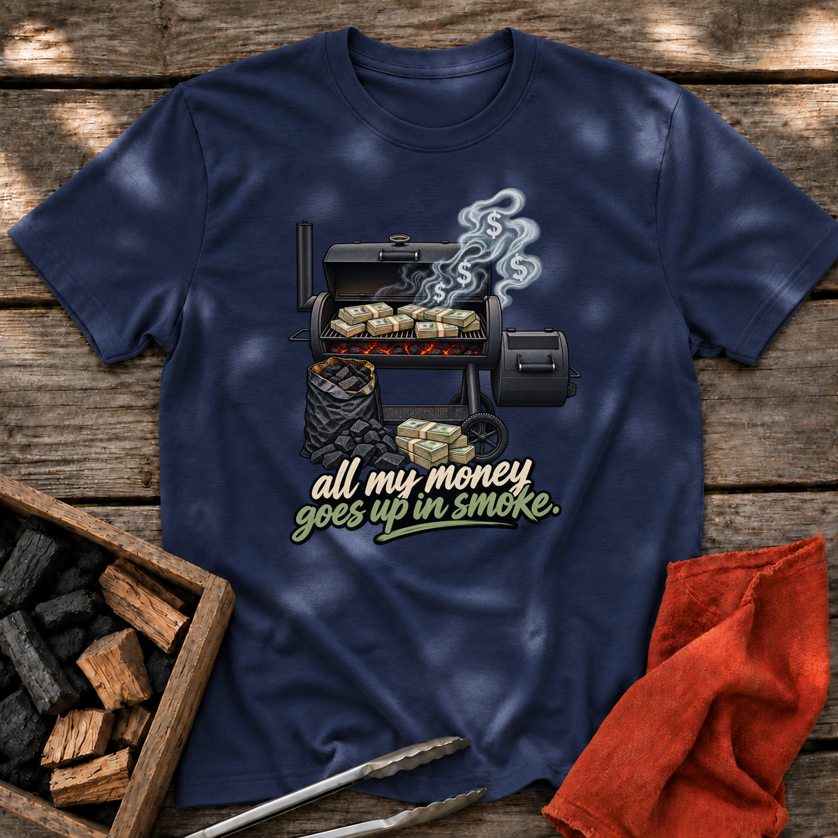 Navy T-shirt with the design “all my money goes up in smoke.” printed on the front.