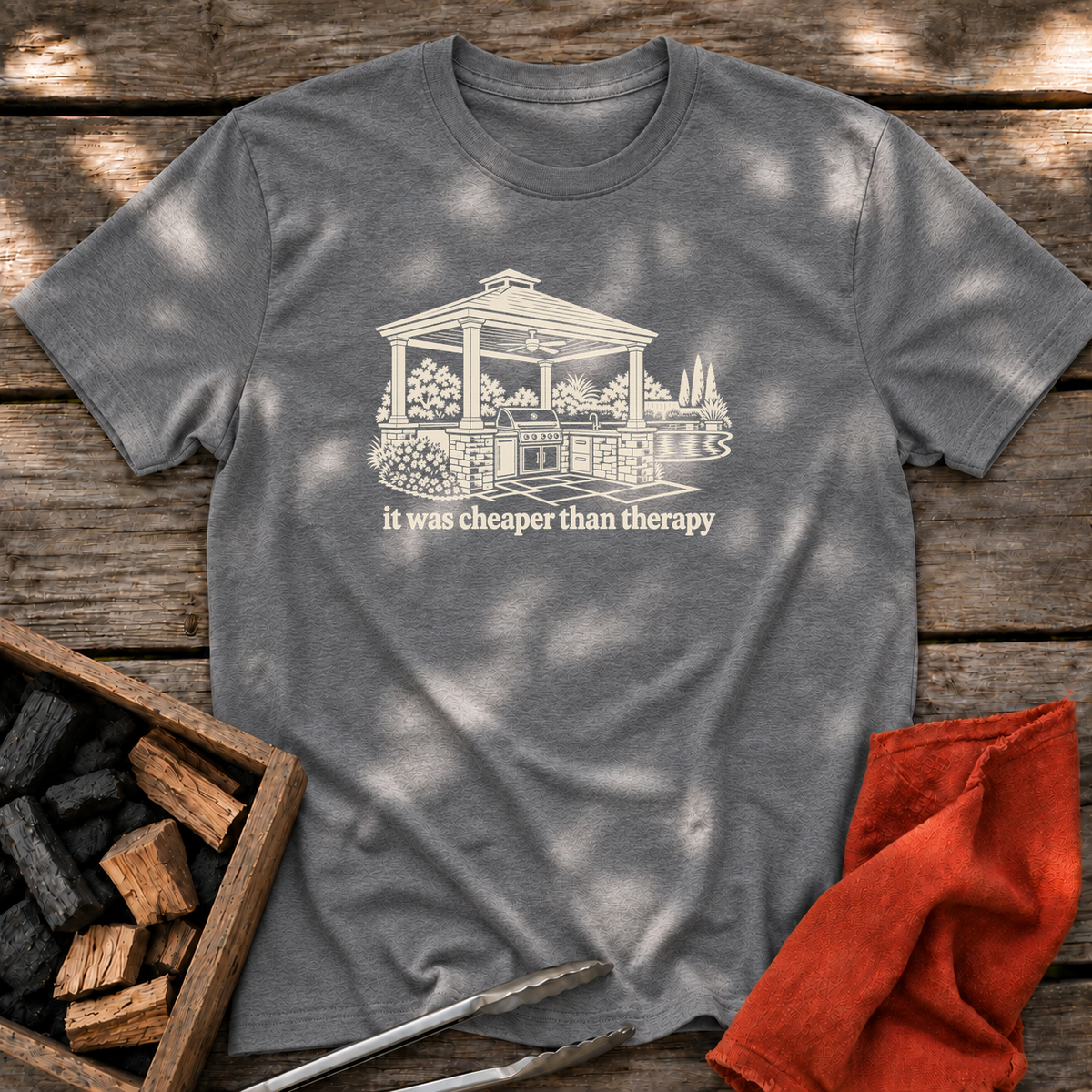 Graphite Heather T-shirt with the design “it was cheaper than therapy” printed on the front.